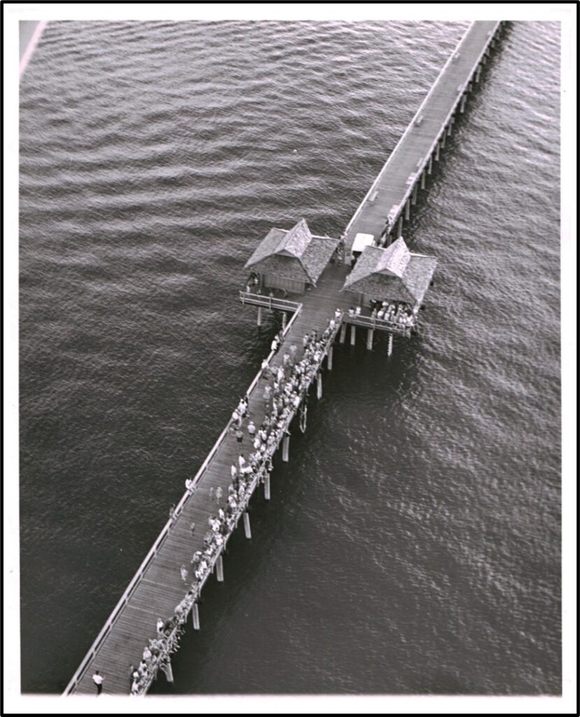 Naples Pier opening days after 1960's Hurricane Donna had destroyed it. From the Norris-Gaynor collection.